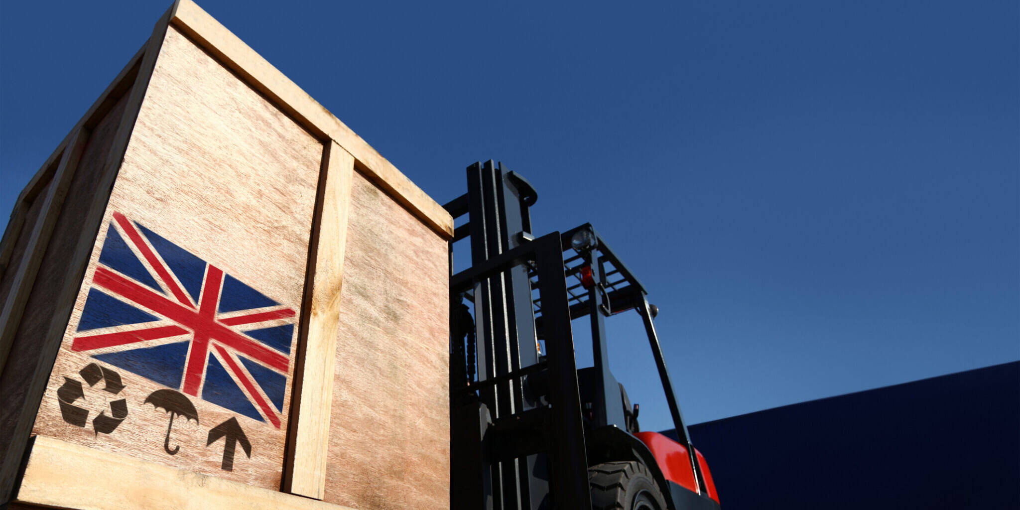 Forklift truck with boxes on pallet with union jack flag logo